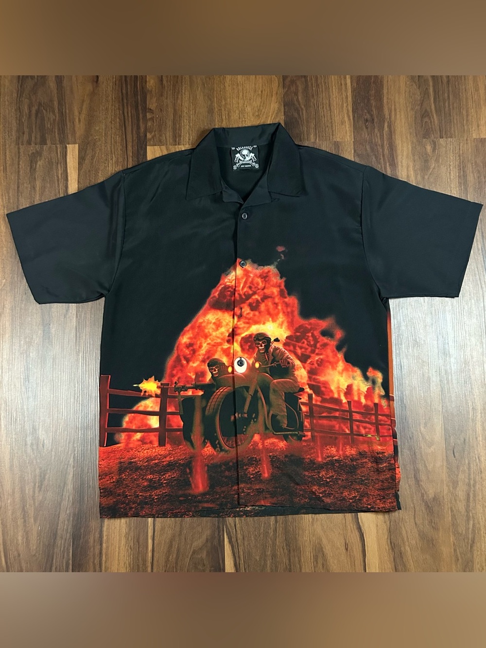 Roadhouse button up T with graphic of 2 skeletons on motorcycle and an explosion